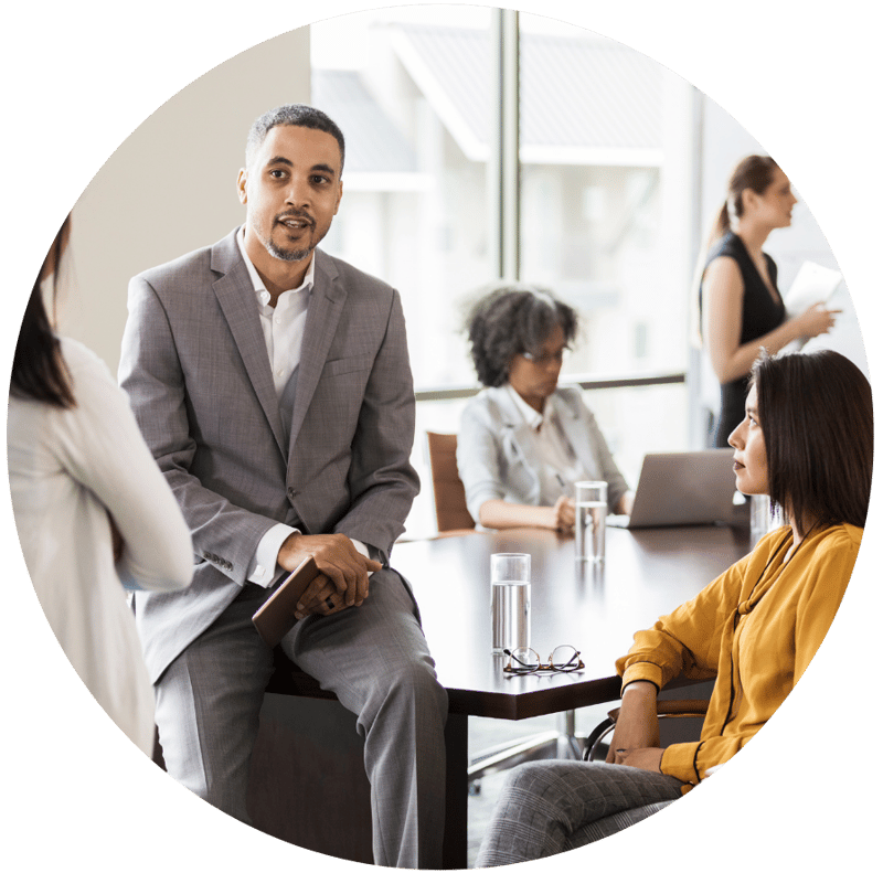 business executives conversing after a meeting